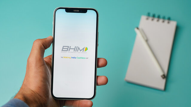 BHIM UPI mobile phone app on colour background: Kolkata, West Bengal, India - December 15 2022