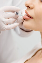 Lip Augmentation. Woman Getting Beauty Injection For Lips