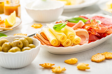 Appetizers with differents antipasti, charcuterie, snacks, meat platter with cheese and spicy olives