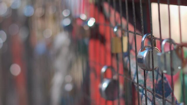 Closeup shot of locks attached on the bridge at Manikaran near Kasol in Himachal Pradesh, India. Bridge above the river Parvati .