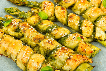 Asparagus baked in bread, grissini.