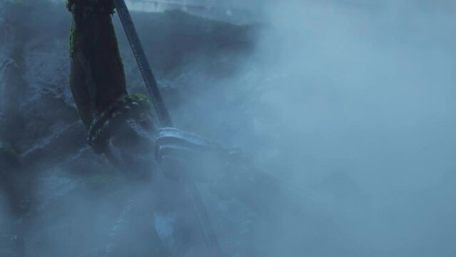Slow motion shot of the water vapour around the statue of Lord Shiva at Manikaran shiva temple at Manikaran in Himachal Pradesh, India. Lord Shiva religious background. Fog around statue of Lord Shiv.