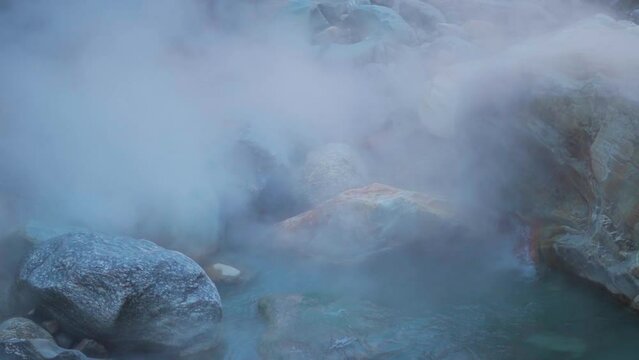 Slow motion shot of water vapors rising from the natural hot water springs at Manikaran near Kasol in Himachal Pradesh, India. Water vapor rises from hot water springs. Natural hot spring.