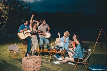 Fototapete Camping summer party camping of friends group with guitar music, happy young woman and smiling man having fun in vacation holiday, nature outdoors travel of friendship lifestyle together, bar-b-q party time