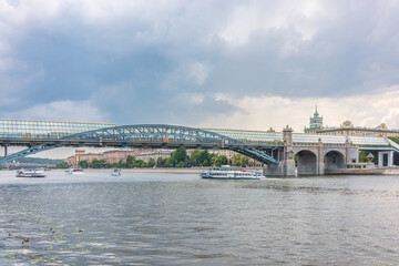 View of the Moscow river embakment, Pushkinsky bridge and cruise ships at sunset.