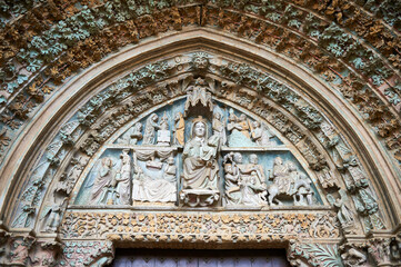 Polychrome Gothic portal of the church of Santa María la Real de Olite with biblical images with the Virgin Mary in the center of the tympanum