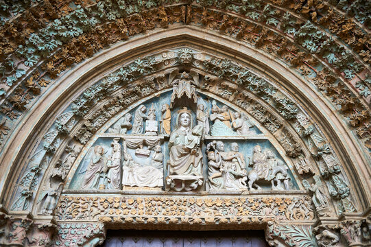 Polychrome Gothic portal of the church of Santa María la Real de Olite with biblical images with the Virgin Mary in the center of the tympanum