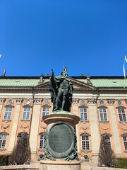 Gustavo Erici statue outside Riddarhuset building in Stockholm Sweden. Blue sky.