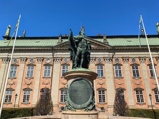Gustavo Erici statue outside Riddarhuset building in Stockholm Sweden. Blue sky.