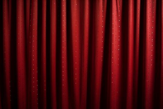 Background of red spotted real theatrical curtain or drapes texture