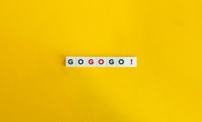 Go, Go, Go Banner and Concept. Block Letter Tiles on Yellow Background. Minimal Aesthetics.