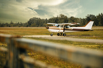 Airplane on the runway in the field  © Alex
