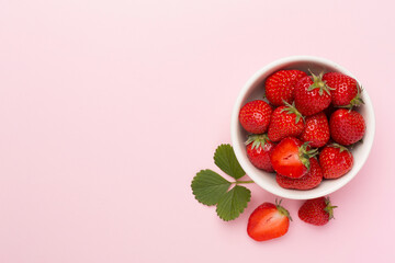 Strawberries on color background, top view