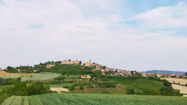 Concept of home escape, contact with nature, vacation and leisure. The enchanting landscape of Moferrato,Piedmont, Italy. On the hill stands the village of Montiglio. Lands of good wines and good food