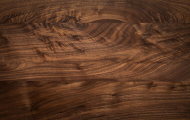 wood texture background. Dark tone walnut wood table top texture background. Solid wood top. Empty desktop.