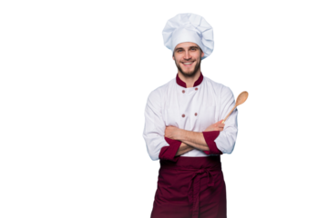 Portrait of positive toothy chef cook in beret, white outfit having tools in crossed arms looking at camera