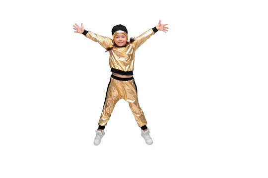 Happy little girl in gold suit dancing jumping isolated on transparent background