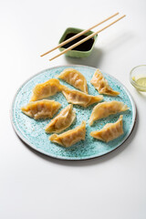 Oriental food gyoza with sauce. Gyoza with pork  ceramic plate