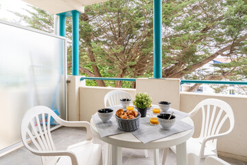 Breakfast on a terrace on a summer morning, healthy breakfast on a terrace of a summer house