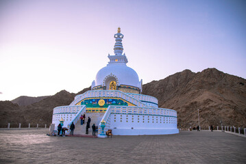 Evening sunset view of Shanti stupa, the big stupa in Leh - Ladakh - India. People visiting Shanti Stupa