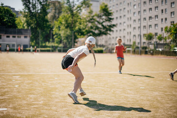 Young female player hitting the ball