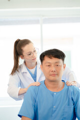 Fototapeta premium Patient at the physiotherapy doing physical exercises with docter therapist.