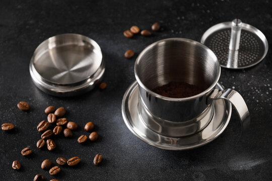 Vietnamese Drip Filter For Coffee Of Stainless Steel On Black Background. Traditional Metal Coffee Maker For Office, Home And Travel. Close Up.