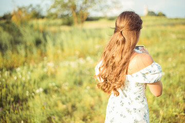 Obraz premium woman in the field, beautiful dress
