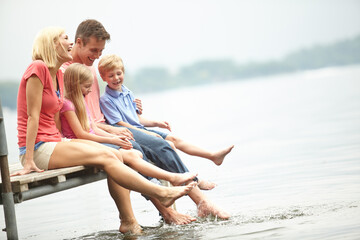Family, holiday and water with mockup and foot at lake during the summer for travel with love....