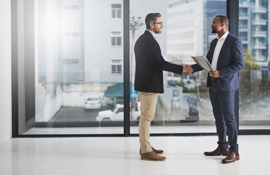 Business men, hand shake and welcome for partnership, agreement and team building with diversity. Businessman, partner and shaking hands with respect, hr onboarding or b2b collaboration for teamwork
