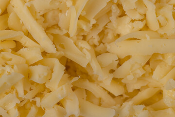 Hard cheese with holes grated into thin small slices
