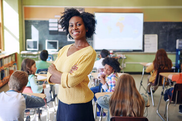 Portrait, black woman and teacher with arms crossed, students or happiness in a classroom. Face,...