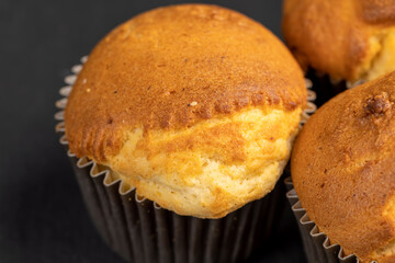 Soft and fresh fragrant wheat cupcake on a black stone