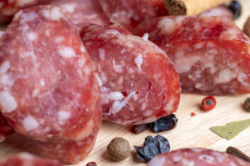 Dried veal sausage during slicing