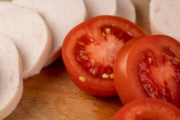 Sliced ripe red tomato on the table