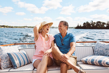 Laughing, happy couple and on a boat for retirement travel, summer freedom and holiday in Bali. Smile, love and a senior man and woman on a yacht for vacation adventure, luxury and a cruise date - obrazy, fototapety, plakaty