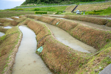 石川県輪島市の白米千枚田を観光する風景。日本の田んぼ。Scenic view of...