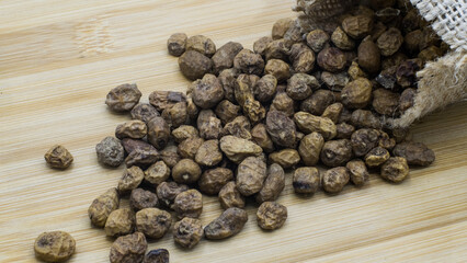 Tiger Nuts Displayed on Wood with Bag