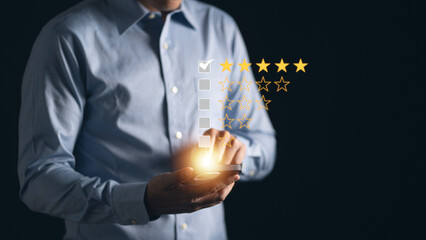 Man pointing at five stars icons, representing positive customer satisfaction concept. Excellent...