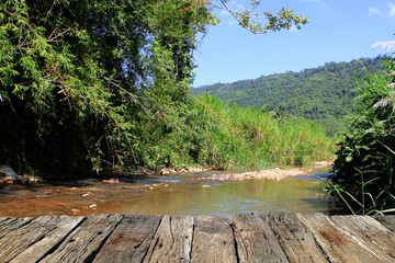Wooden floor and river in the forest of Thailand, Asia.