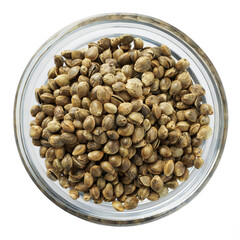 hemp grains in a glass transparent bowl close-up isolated on a white background