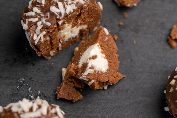 Chocolate candies in the form of balls with milk coconut