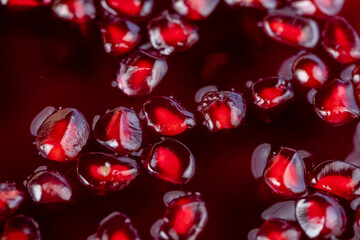 peeled red ripe pomegranate with red sweet grains