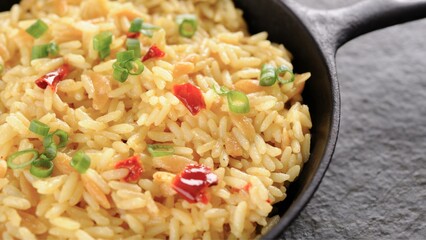 Flavorful Fusion: Top-View Close-up of Chicken Fried Rice Infused with Vibrant Vegetables