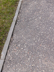 a gravel and stone-strewn walking path in the park