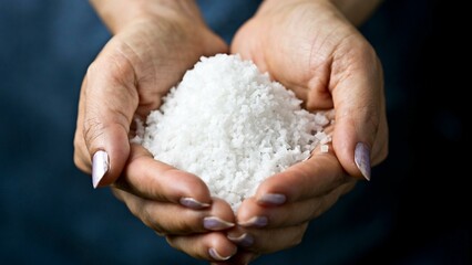 Natural Seasoning: Top-View Close-up of Coarse Sea Salt Grasped in a Hand