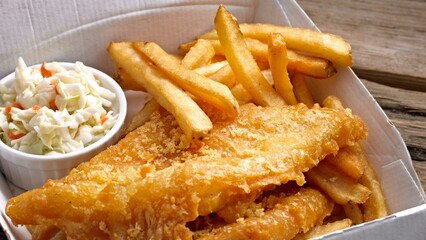 Delectable Delights: Captivating Closeup of Fish and Chips with Golden French Fries