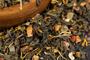 fresh green tea with pieces of fruit and berries