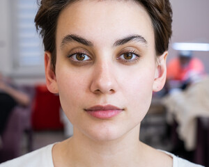 Portrait of a caucasian woman after eyelash lamination procedure. 