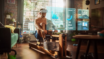Virtual Reality Metaverse Futuristic Home Gym. Man Exercising on Row Machine Wearing Virtual...
